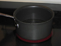 A pot of water on the stovetop.