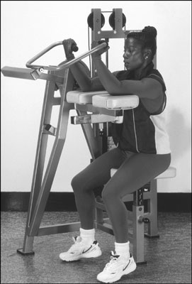 The arm-curl machine is a gym alternative to the dumbbell biceps curl. [Credit: Photograph by Sunst
