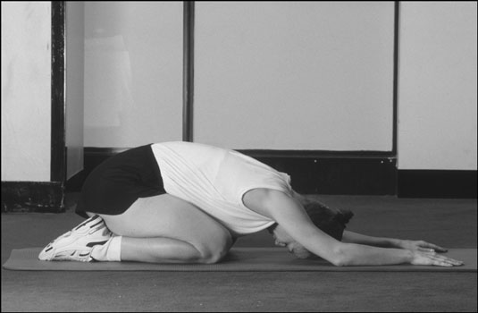 The child's pose in yoga. [Credit: Photograph by Sunstreak Productions, Inc.]