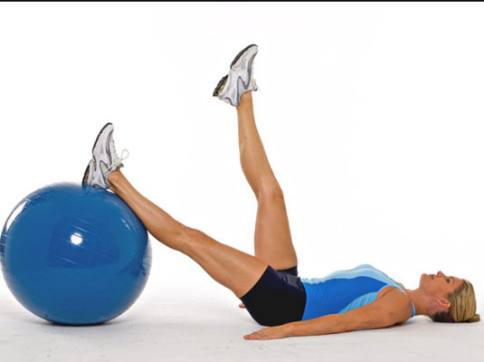 Lie on the floor, placing your left leg on the ball.