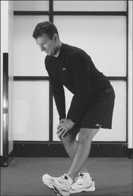 The standing hamstring stretch targets your rear-thigh muscles. [Credit: Photograph by Sunstreak Pr