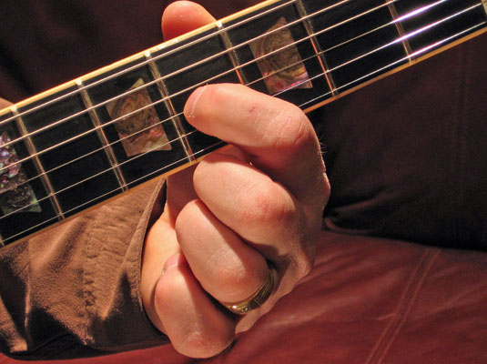 Play the fourth (<i>not</i> the fifth!) fret of the G (3rd) string and then play the open B (2nd) string.