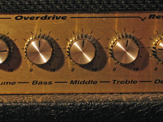 Turn the tone controls — bass, middle, and treble — to their midway point.