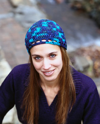 A woman wears a blue cloche hat
