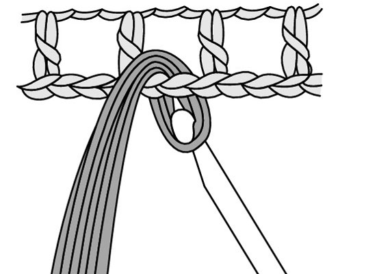 Take your hook and draw the loop through the stitch that you’re attaching the fringe to.