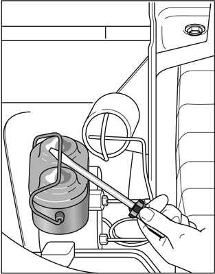 Release the lid of a metal master cylinder with a screwdriver.