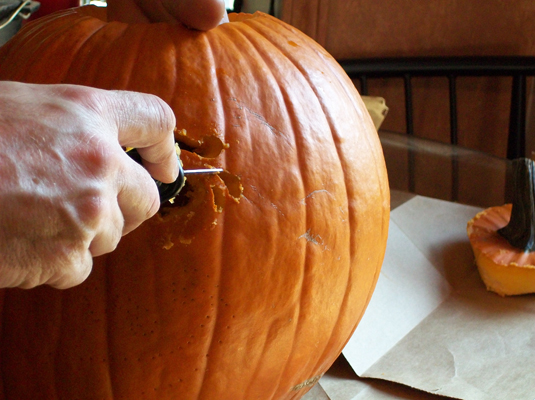 With a serrated knife or sawing tool, <i>saw,</i> don’t slice, through the pattern lines using short back and forth motions. Push out the pieces, and trim the edges.