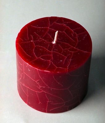 Create cracks in your candle by overdipping and freezing it several times.