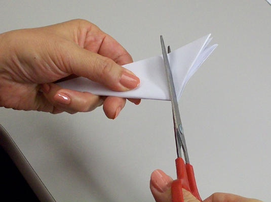 Flip the paper over and cut that extra triangle off the top.