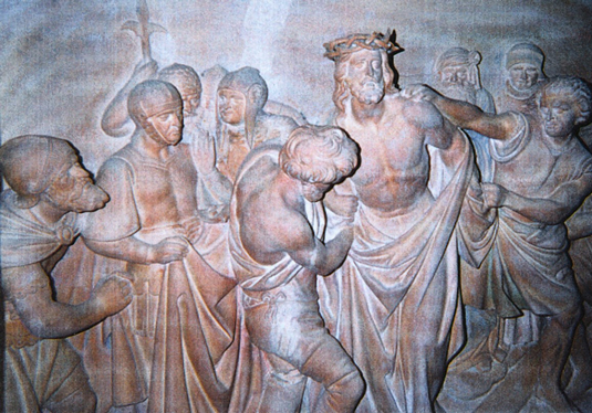 This stone carving of the Tenth Station shows Jesus being stripped of his garments (John 19:23).