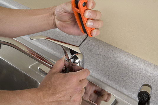 Loosen the setscrew with the hex wrench, and remove the handle.