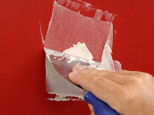 With the putty knife, apply a thin coat of plaster patching compound over the crack.
