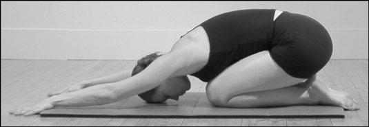 Finish by<b> </b>pressing back to the rest position, sitting on your heels to release your back.