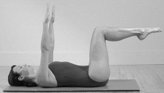 Lie on your back with your knees bent and up in the air, your knees and hips forming 90-degree angles.
