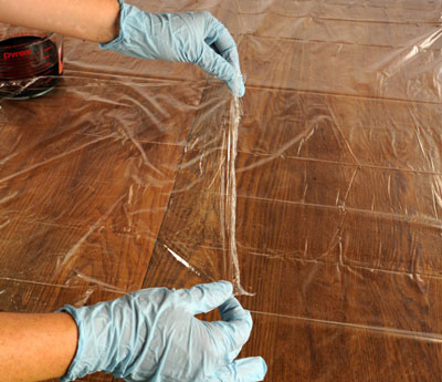 Spread two sheets of plastic wrap side by side, overlapping the plastic by 2 inches.