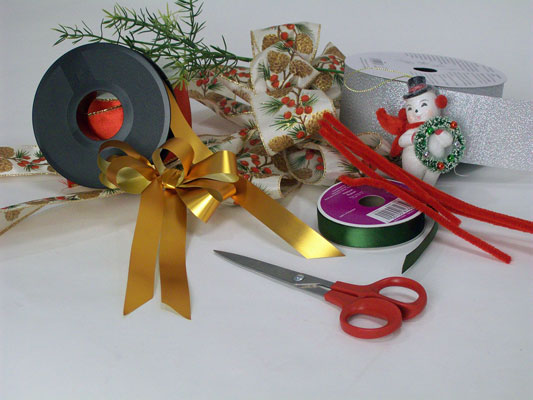 Assemble your materials: Spools of ribbon, sharp scissors, coordinating chenille stems (pipe cleaners) or clear plastic twist ties.
