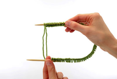 Slide the stitches along the cable so that they are evenly distributed along the entire length of the circular needle.