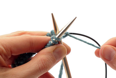 Knit into the first stitch on the left-hand needle to join your work. Then knit across the remaining stitches on the left-hand needle.