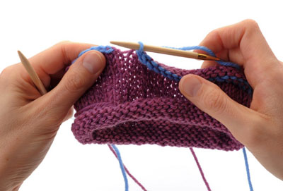 Knit one more stitch, so that there are again two stitches on the right-hand needle to the left of the end-of-round marker. Then again lift the first stitch over the second and off the right-hand needle. Repeat until you reach the end of the round and one stitch remains on your right-hand needle.
