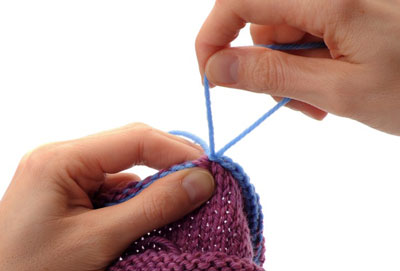 Cut the yarn, leaving an eight-inch tail. Slip the final loop off the needle and pull this loop up until the yarn tail comes free and the loop no longer remains.
