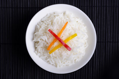 White rice digests rapidly in your body, creating that cascading effect of increased insulin levels, increased fat storage, and an increased waistline over time.