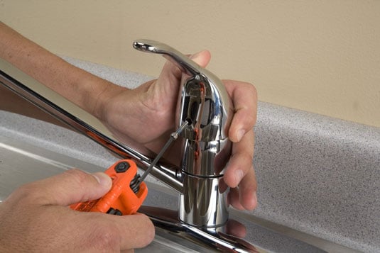 Remove the retaining screw and lift off the handle.