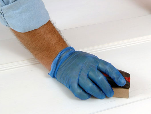 Smooth any chipped paint or bumpy imperfections with 180-grit sandpaper.
