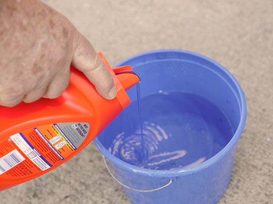 Add the bleach to the water first, then the detergent.