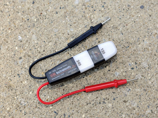 Get a voltage tester that’s rated for up to 500 volts.