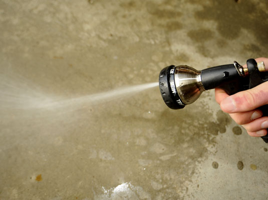 Rinse the pavement with plenty of water from the garden hose.