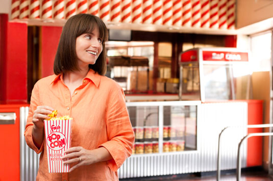 Go to a movie theater and watch a movie — with friends or alone.