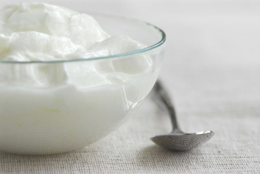 You can purchase plain yogurt in larger containers (not single servings) for about $0.60 per 6-ounce serving.