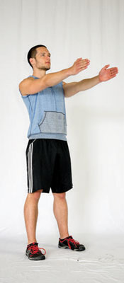 Assume a hip-width stance and point your toes slightly out. Reach your arms out in front of you for balance.