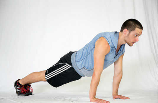 Set up at the top of your push-up position.