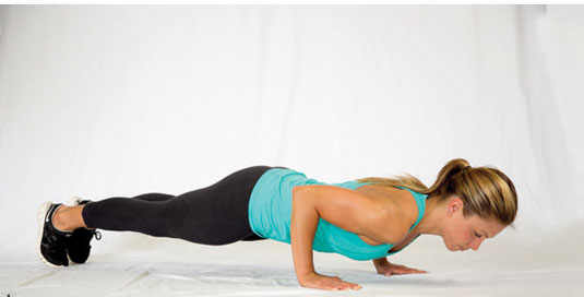 Tuck your toes, tighten everything up, and set your back flat (so a straight line runs from the back of your head down through your tailbone throughout the entire push-up).