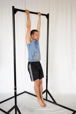 Grab hold of a bar with your hands shoulder-width apart and palms facing you.