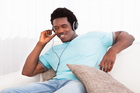 If you're feeling a lag in energy on a fast day, slip on a pair of headphones and listen to music.