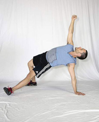 Bridge by pushing your heel into the ground, squeezing your butt, and driving your hips up into the air.