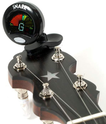 Using an electronic clip-on tuner makes banjo tuning easier. [Credit: Photograph courtesy of Elderl