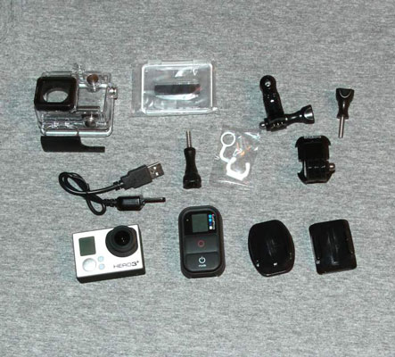 Take all the pieces out of the box (such as the battery, mounts, and rings) and lay them out, as shown here.