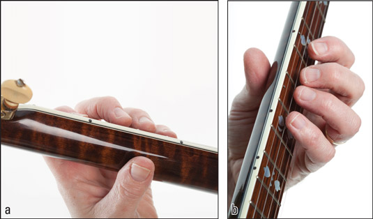 (a) Placing the thumb on the back of the neck and (b) moving your fingers close to the strings for 