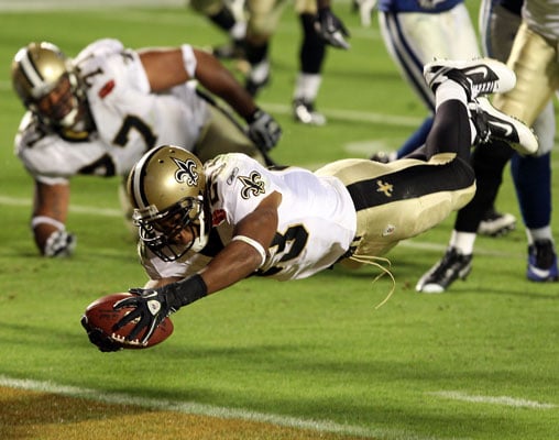 Pierre Thomas of the New Orleans Saints scores a touchdown against the Indianapolis Colts in Super 