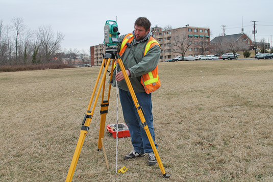 Site surveyors surveying land with traditional means. [Credit: Source: Elvert Barnes/Creative Commo