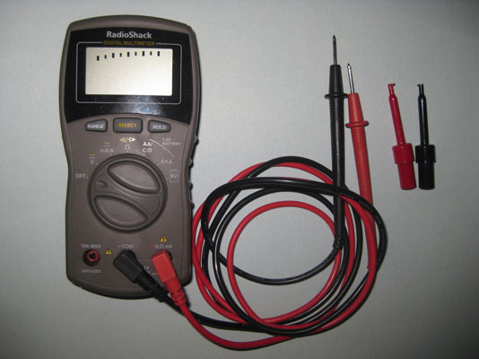 A <i>multimeter</i> and spring-loaded test clips.