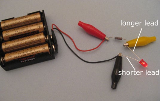 Alligator clips connect components in this simple LED circuit.