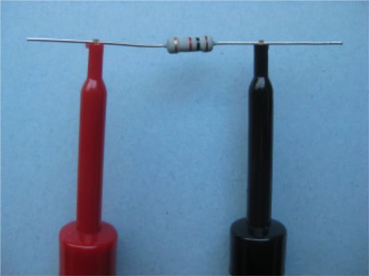 Use your multimeter set on ohms to measure the actual resistance of a fixed resistor.