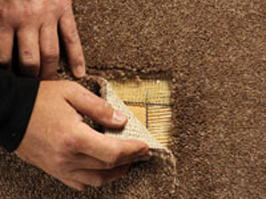 Affix the patch to the undamaged flooring.