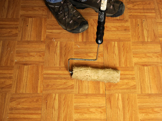 Pull out the nails from the walls, floor, and molding and clean the existing flooring.