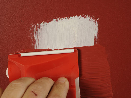 Apply touch up paint to the patch in your wall color.