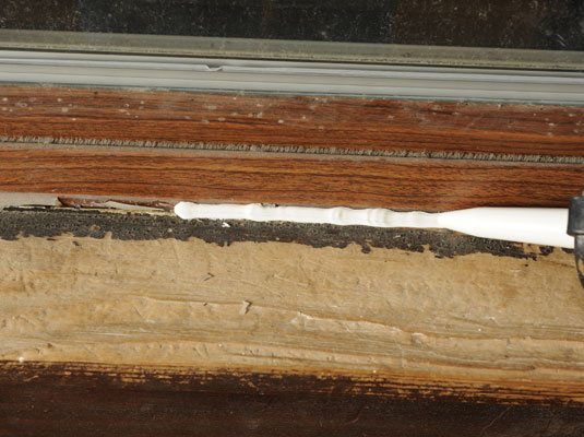 Apply a bead of caulk along one of the cracks.